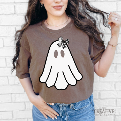 Model wearing an Espresso Bow Ghost tee featuring a white ghost with a black-and-white checkered bow.